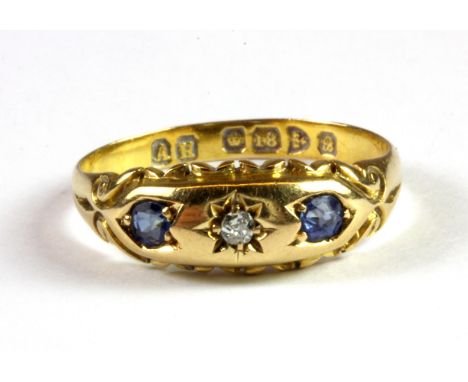 An 18ct yellow gold diamond and sapphire set ring, (N.5).