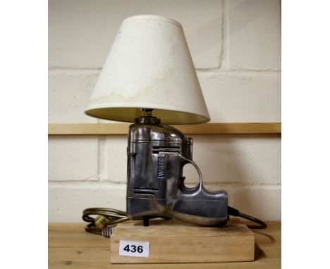 A vintage Wolf hand drill mounted as a novelty table lamp, H. 33cm.
