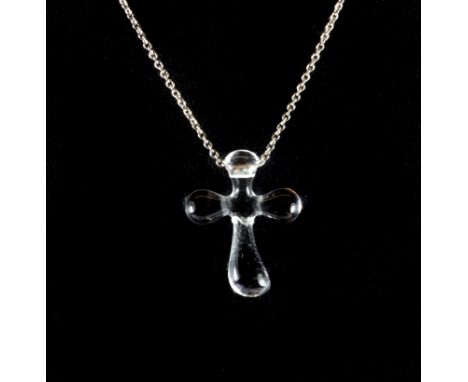 A Tiffany & Co Elsa Peretti designed carved rock crystal pendant on a platinum chain, (pendant a/f).