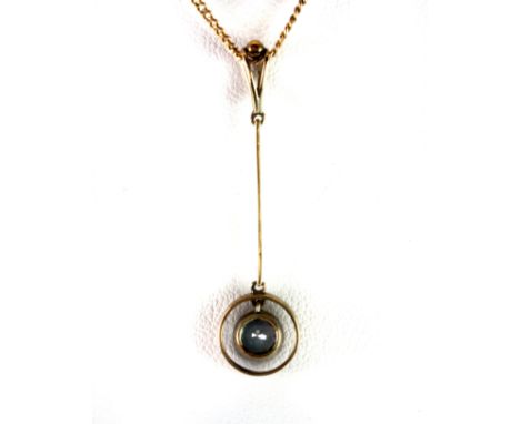A yellow metal (tested 9ct gold) aquamarine set pendant and chain.