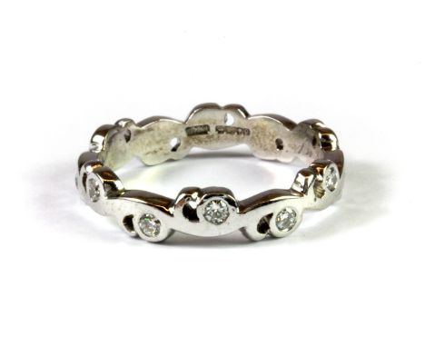 An 18ct white gold diamond set ring, (Q).