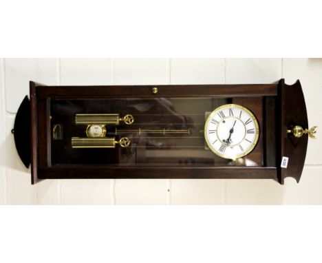 A mahogany cased two train Vienna style wall clock, H. 120cm.
