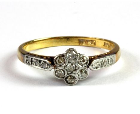 An Edwardian 18ct yellow gold and platinum diamond set cluster ring with diamond set shoulders, (L).