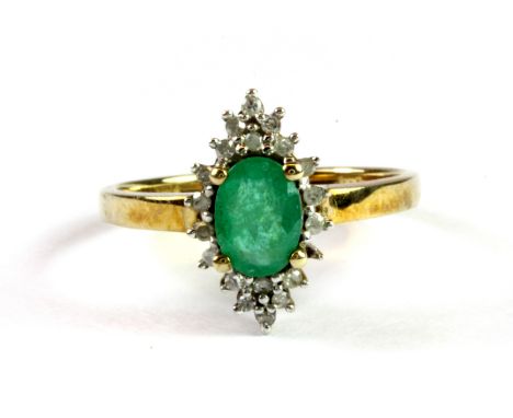 A 9ct yellow gold emerald and diamond set ring, (P.5).