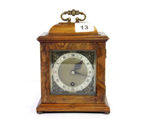 A good quality walnut cased miniature bracket clock by Goldsmiths and Silversmiths company London, H. 21cm.