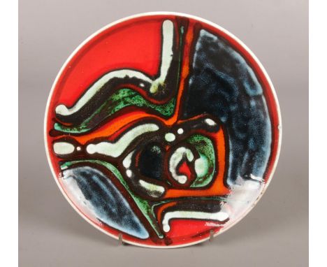 A Poole decorative dish with unusual design. Marks to the base. 20cm diameter.  