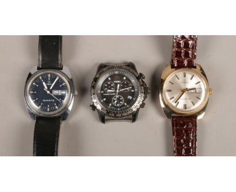 Three Vintage Timex watches. To include two Timex Quartz 1500A Q cell with leather straps and date facility, along with a Tim