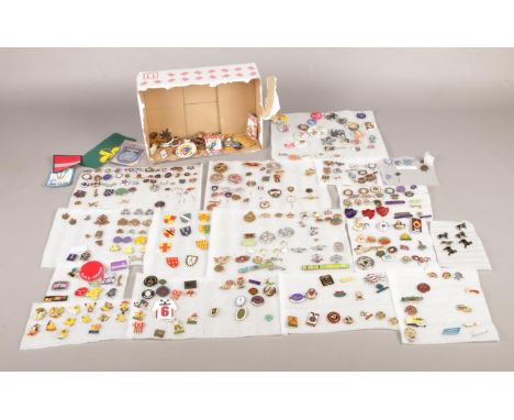 A large quantity of enamel lapel badges. Subjects to include Boys &amp; Girls Brigade, sports, pop music and transport etc.  