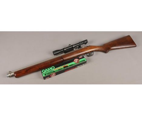 A Sheridan Blue Streak bolt action air rifle with Gamo 6x20 scope. No 344874 .20 cal. CAN'T POST THIS ITEM.  This gun cocks a