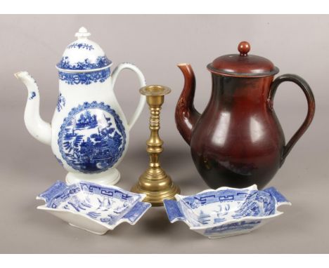 A collection of antique ceramics and a brass candlestick. Includes Pearlware coffee pot, Rockingham coffee pot and two blue a