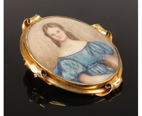 A large Victorian pinchbeck brooch/pendant, portrait of a maiden. 7cm x 6cm.  