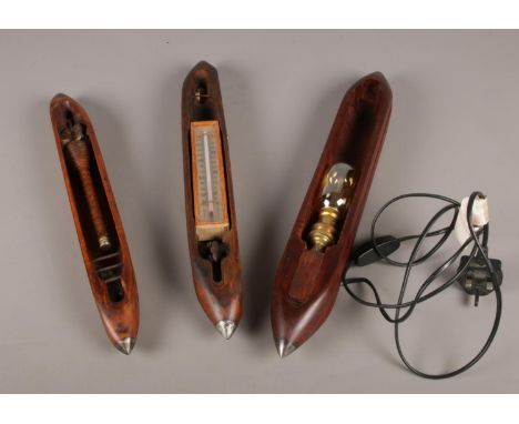 Three vintage loom shuttles. One been converted to a novelty light.  