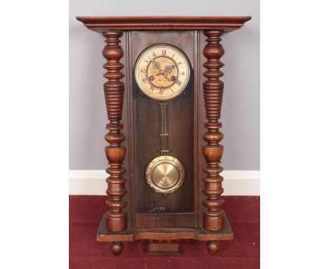 A 19th century eight day German mahogany wall clock with pendulum. Comprising of an enamel dial with Roman numerals. Comes wi