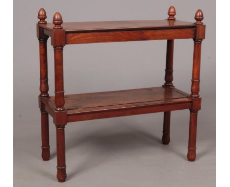 A mahogany two tier side table with removable lower shelf and turned supports. Four finials to the top on each corner.  