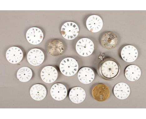 An assortment of pocket watch movements. Includes Ingersoll Yankee Bicycle Watch.  