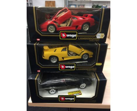 Three Bburago 1/18 scale Lamborghini diecast models: 3037 Countach (1988); 2 x colour variations of Diablo (1990). Appear E/M