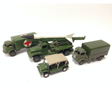 Four Dinky Toys military models: 665 Honest John Missile Launcher  (G with missile); 601 Austin Mini Moke with tan canopy (VG