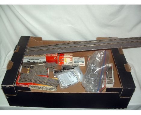 A tray containing Fleischmann Profi Track, Point Motors,Track Feed Clips, other Switches and Coach/Wagon couplings - Profli T