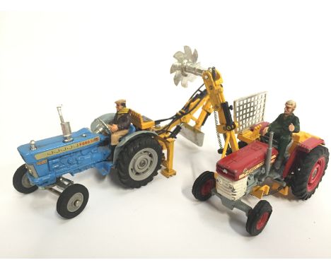 Two Corgi Toys tractor models: 74 Ford 5000 Super Major Tractor with Hydraulic Scoop; 73 Massey Ferguson 165 Tractor with Saw