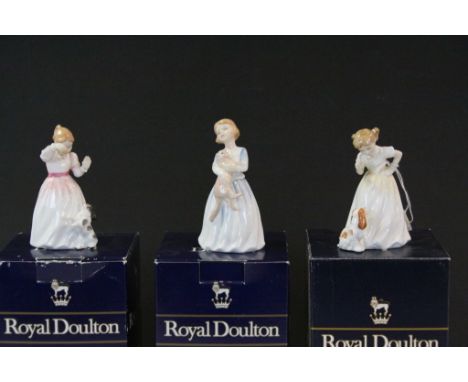 Three boxed small Royal Doulton ceramic figurines to include; HN3122 My First Pet, HN3123 Sit, HN3291 Reward