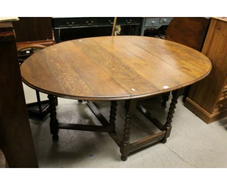 Oak Gate-leg Table with Oval Flaps and raised on Barley-Twist Legs, 180cms long x 122cms wide x 73cms high