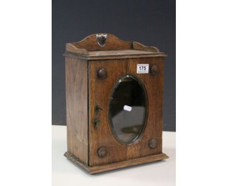 Vintage Oak Smokers cabinet with Glazed bevelled glass panel to front, measures approx 36 x 25 x 17cm at widest points