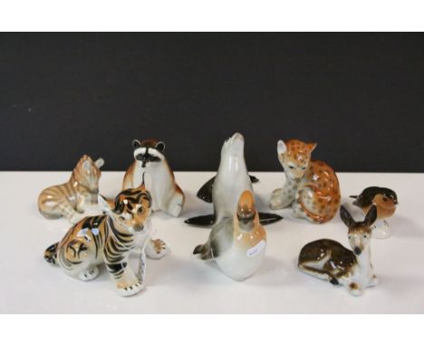 Seven USSR ceramic Animal figurines and another to include; Seal, Lion, Tiger etc