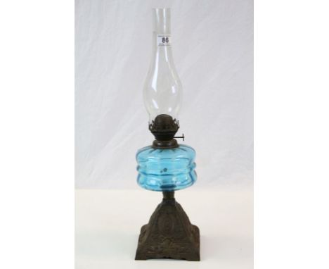 Vintage Oil lamp with blue Glass reservoir and Cast Iron base, stands approx 53.5cm to include the glass funnel