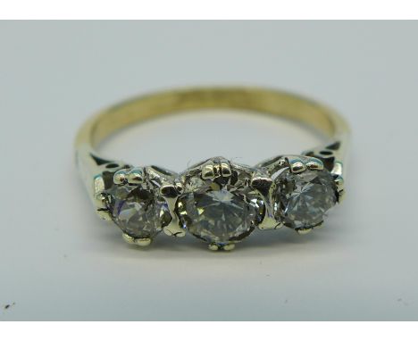 A three stone diamond ring, approximately 1.20 carat diamond weight, 2.6g, R, hallmark worn