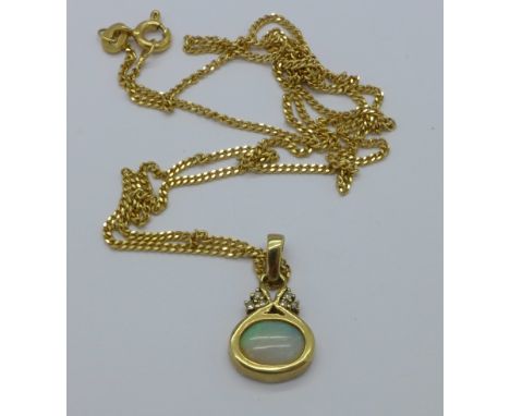 A 9ct gold and opal pendant on a 9ct gold chain, 4.1g