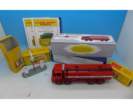 Four Dinky Toys vehicles; 943 Leyland Octopus 'Esso' Tanker, 197 Morris Mini-Traveller, 482 Bedford Van 'Dinky Toys' and 49D 