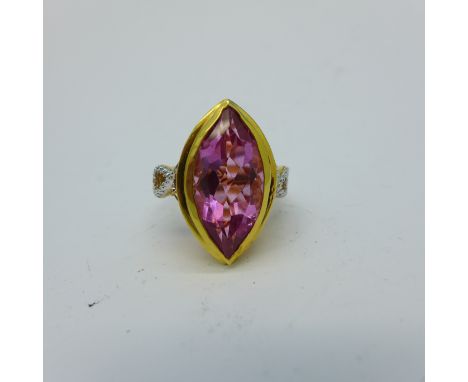 A silver gilt and pink quartz ring with diamond accents, R