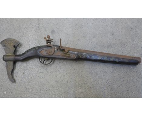 A reproduction flintlock axe pistol, central European