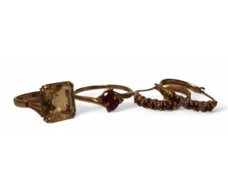 A 9ct gold and citrine cocktail ring, the claw set citrine approx. 12 x 10mm, size N1/2, 3.6g gross; a 9ct gold and ruby ring