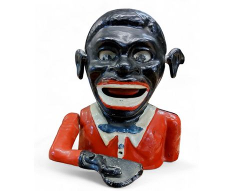 A Jolly Black man aluminium money bank Notice from the the-saleroom.com: These items are listed on the basis they are illustr