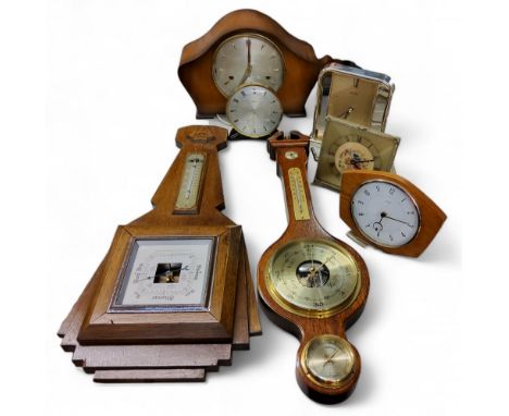 An Art Deco oak barometer, 56cm high, c.1930;&nbsp; &nbsp;a Smiths mantel clock, baton markers, three winding holes, striking