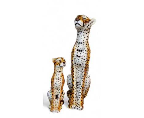 An&nbsp; Italian pottery model of a&nbsp; cheetah, sitting, 85cm high, c1970;&nbsp; another, smaller, 46cm high, both with pa