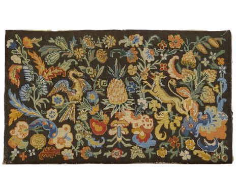 An 18th century style tapestry, central pineapple flanked by mythical beasts and geometrical patterns, 79cm x 47cm, early / m