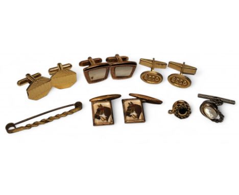 A pair of reverse painted intaglio of Essex style crystal gilt cufflinks each depicting a horse's head; other yellow metal cu