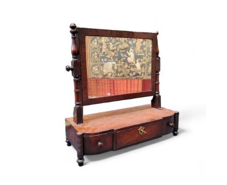 An early 19th century mahogany dressing table mirror, rectangular mirror with cross banded surround, supported by turned upri