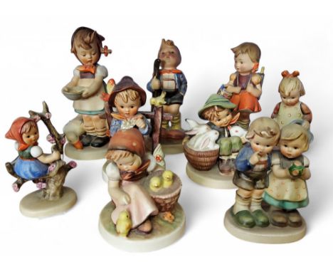 A Goebel figure, designed by&nbsp;M.I.&nbsp;Hummel, Be Patient, 16.5cm high,&nbsp;&nbsp;bee mark;&nbsp; another, Little Hiker
