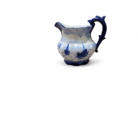 A Royal Crown Derby milk jug, in the manner of W.E.J. Dean, decorated with a continuous scene of sailing boats, 9.5cm high, p