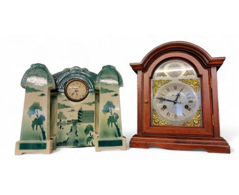A modern mahogany mantel clock, Roman numerals, twin winding holes, inscribed Lincoln, 31 Day, 36cm high;&nbsp; a&nbsp;20th c