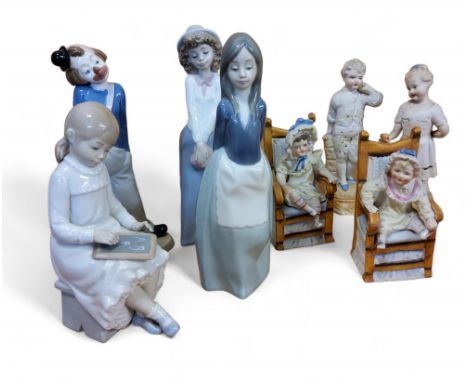 A Nao figure, of a child with a school blackboard, 20cm high, printed mark;&nbsp; others;&nbsp; a pair of German bisque figur