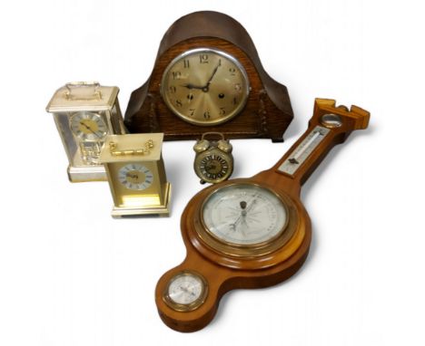An oak Napoleon&nbsp; hat mantel clock, twin winding holes, c.1930; a mahogany wall barometer;&nbsp; President Quartz carriag