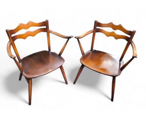 A pair of Ercol 'Cowhorn' armchairs, blue label 