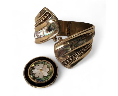A Mexican silver gilt contemporary hinged bangle set with Abalone; a Mexican silver, circular pendant/brooch inlaid with onyx