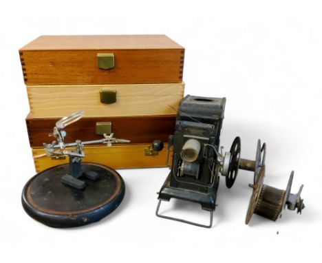 A Marklin projector, c.1940;&nbsp; &nbsp;four slide cases;&nbsp; a magnifier on stand;&nbsp; etc 