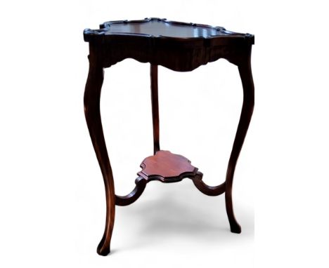 A reproduction mahogany trefoil occasional table, C-scroll gallery, cabriole legs, with central shelf, 91.5cm high, 52cm wide