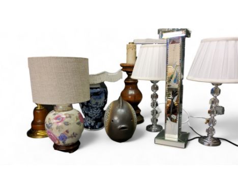 A wooden and gilt side light;&nbsp; another;&nbsp; an oriental style side light;&nbsp; an unusual fish side light, 29cm high;